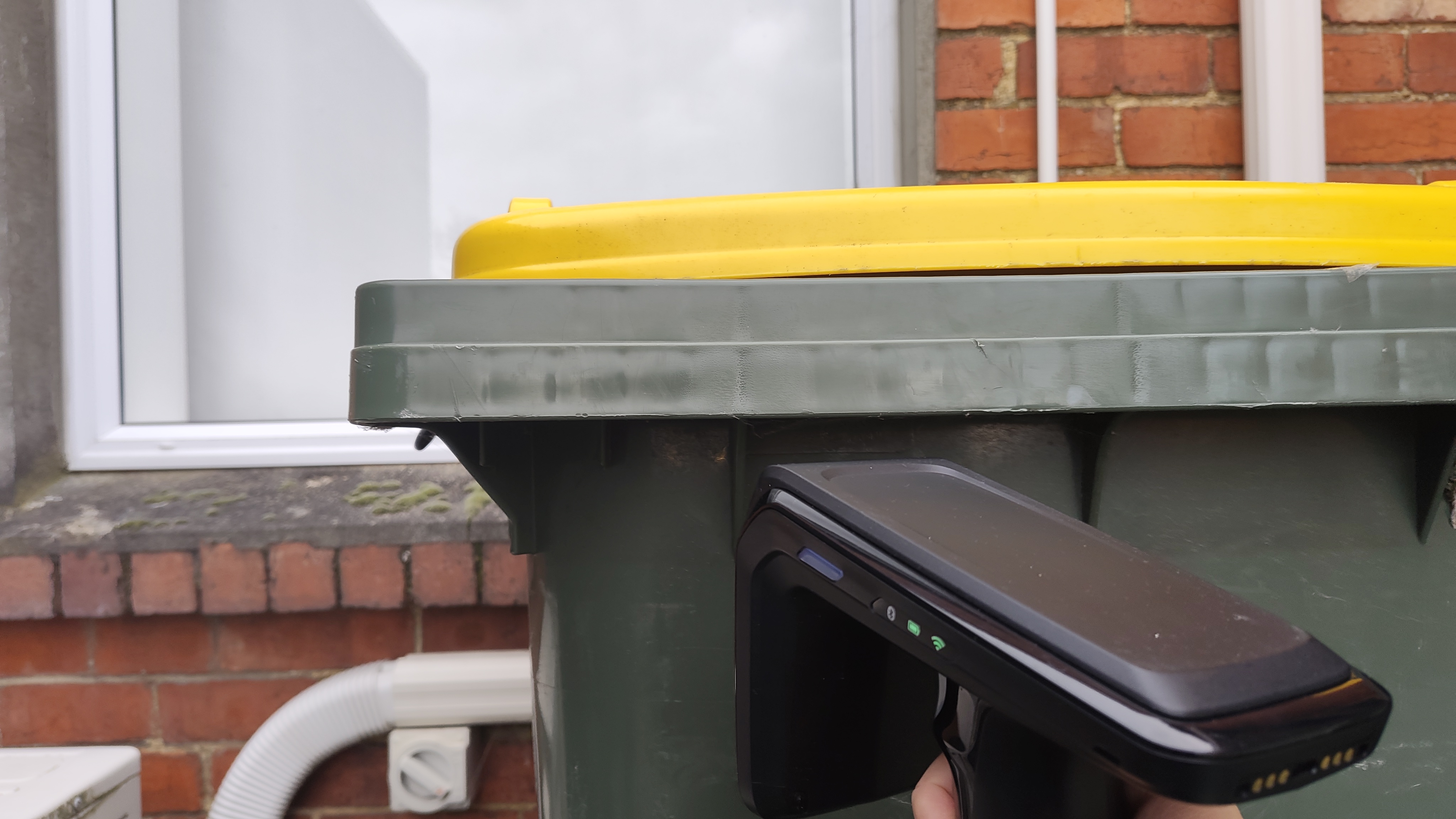 A Zebra Scanner pointing at a New Zealand recycling bin.